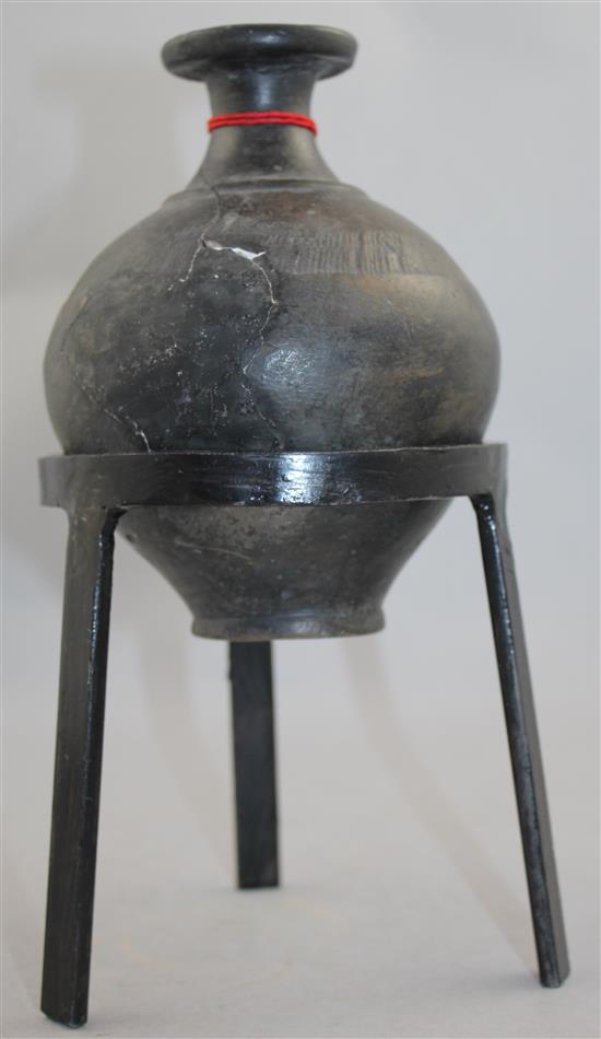 A Greek blackware bottle, Apulia, c.2nd century BC, 15cm, later metal stand